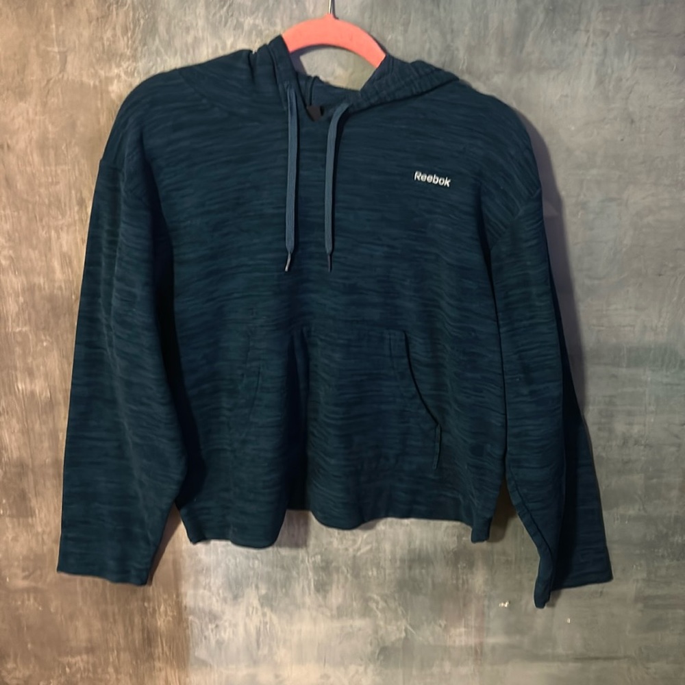 A women’s Reebok blue sweatshirt